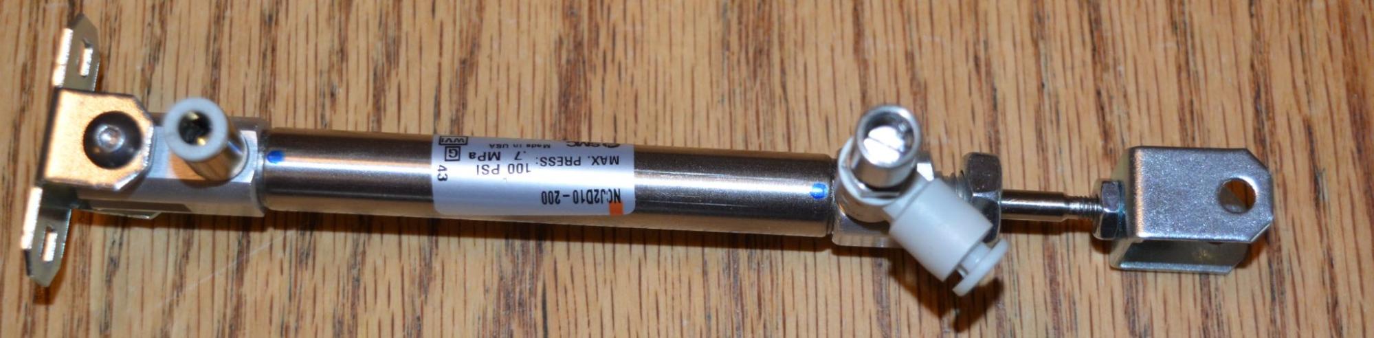 Double acting pneumatic cylinder piece.