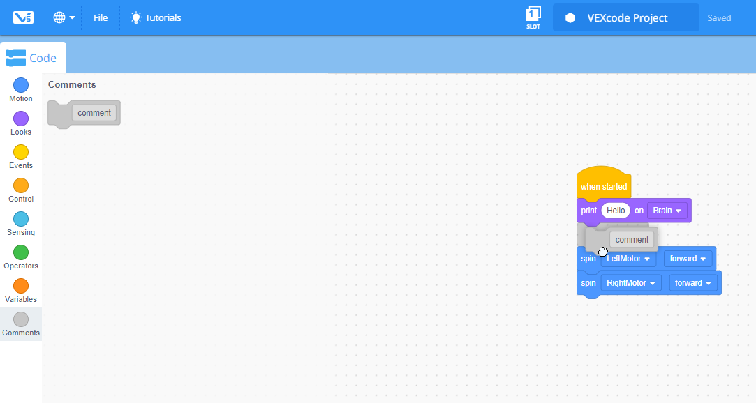 VEXcode V5 blocks workspace that shows a Comment block being dragged from the Toolbox into a stack of blocks.