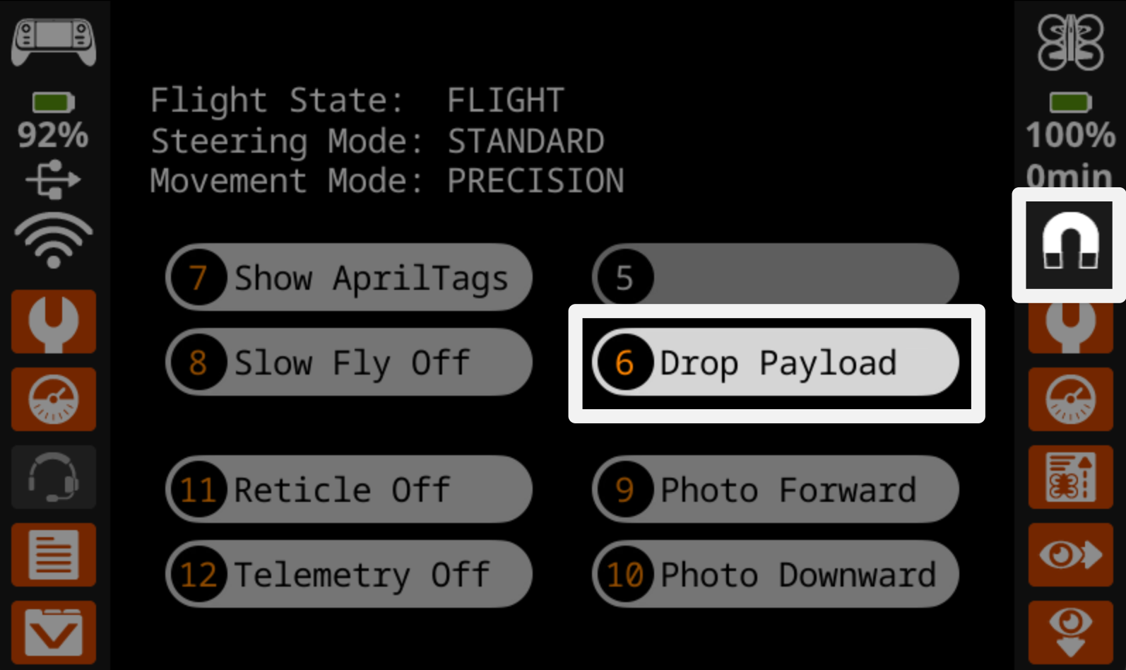 The controller screen during flight with the button 6 that reads Drop Payload on the right hand side highlighted, as well as the magnet icon on the far right of the screen above the drone settings icon.