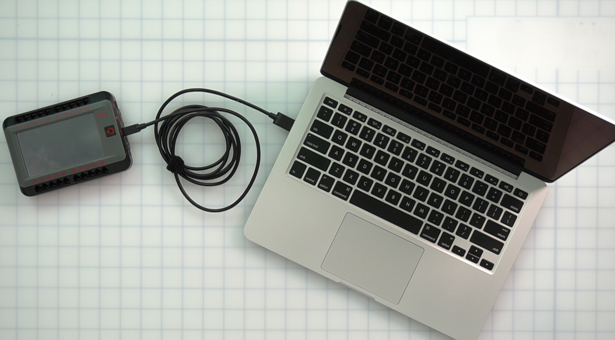 V5 Brain is connected to a laptop using a USB cable.