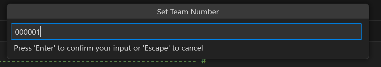 Set Team Number prompt window with a text field and a message below that reads Press Enter to confirm your input or Escape to cancel. In this example, the Team Number is being changed to 000001.
