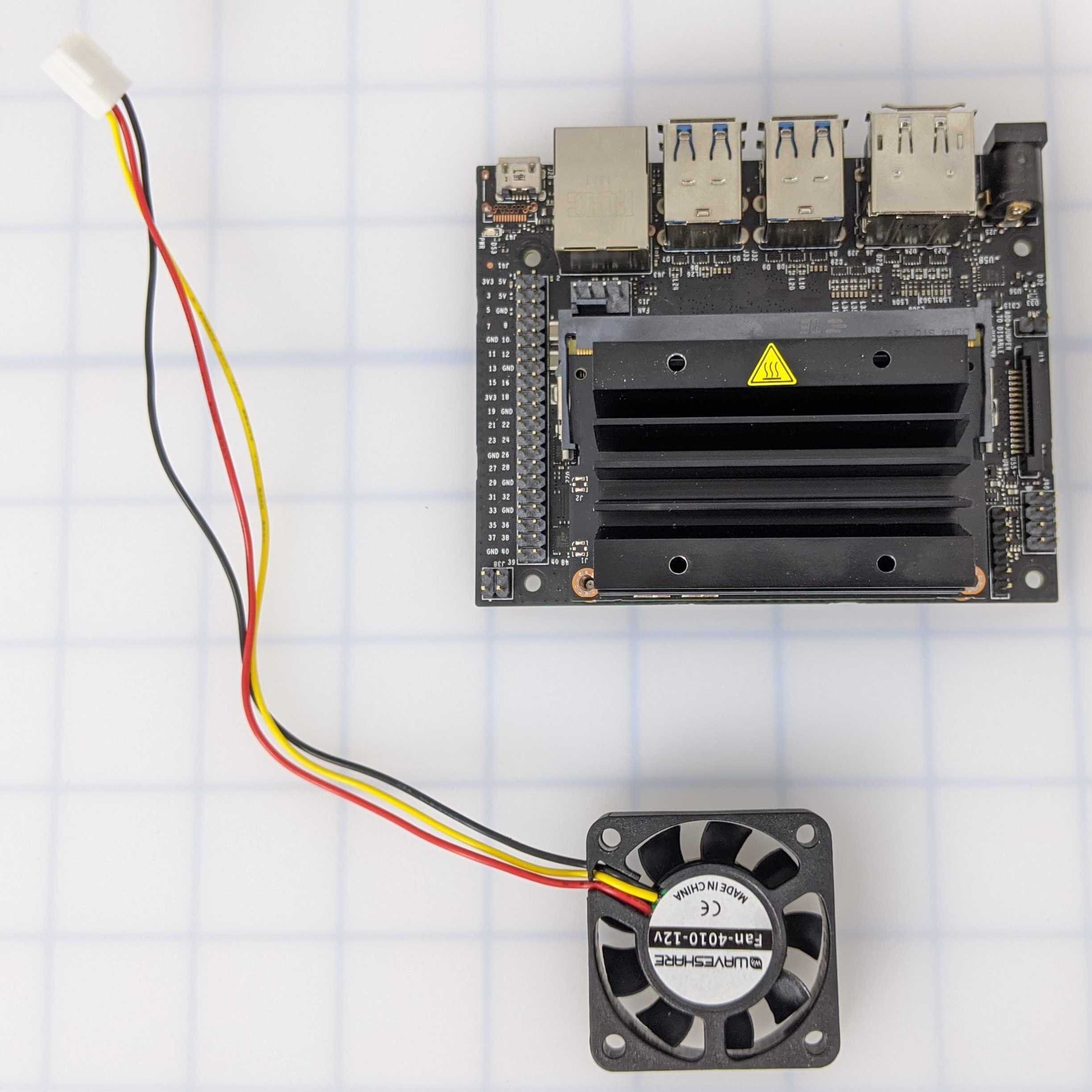 Jetson Nano board and cooling fan shown separately before installation.
