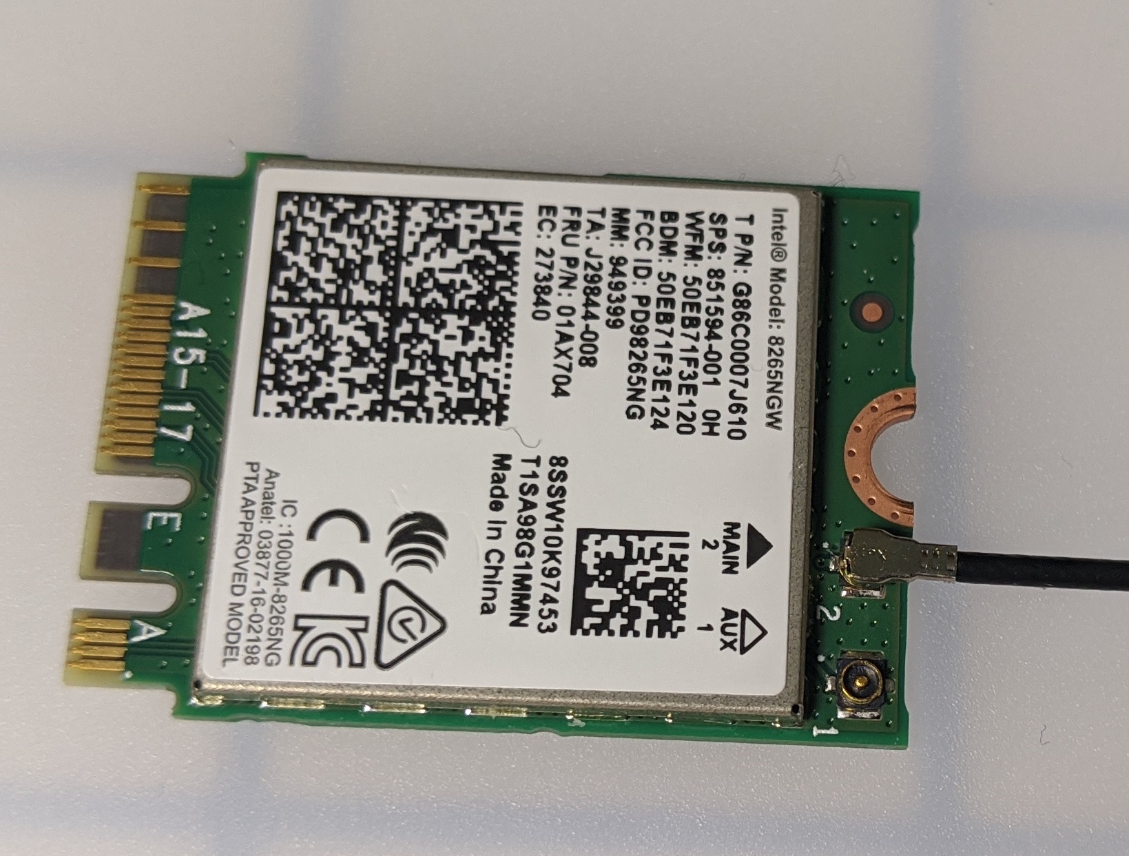 First antenna cable being connected to the Intel Dual Band Wi-Fi module.