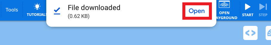 Android notification confirming the VEXcode VR project file was saved to Downloads