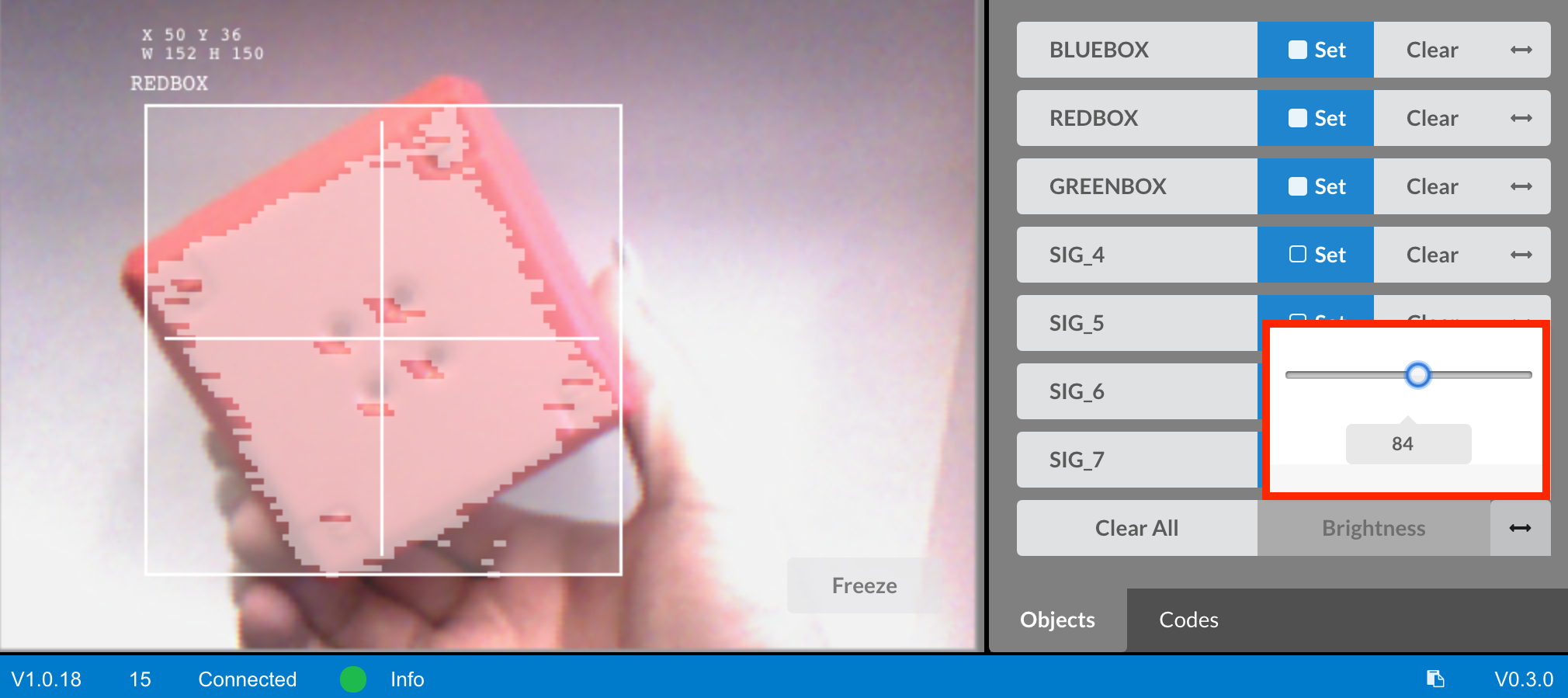 Vision utility showing red object detection with brightness slider adjusted to improve visibility.