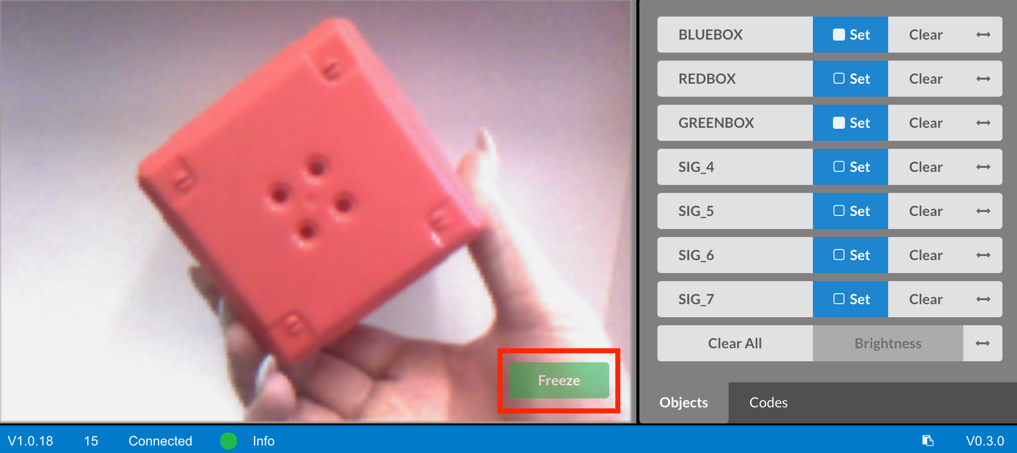 Vision utility showing red object with Freeze button highlighted to capture a still image.