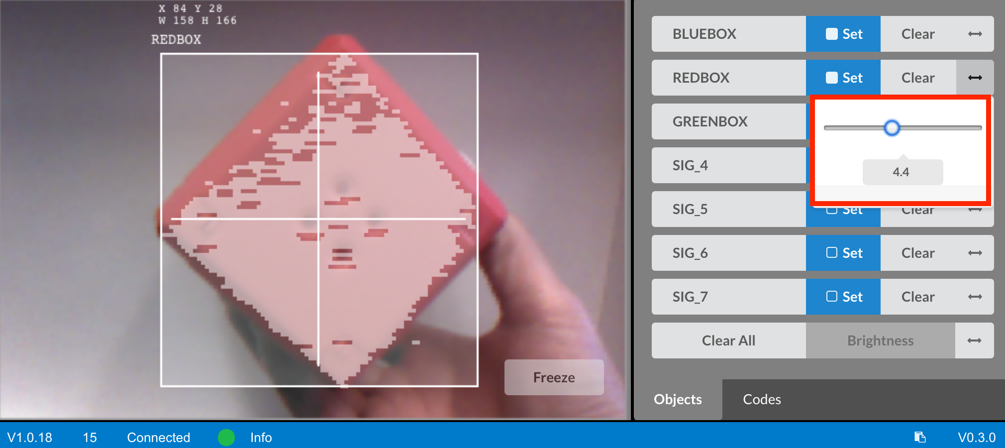 Vision utility showing red object detection alongside signature slider being adjusted to improve recognition.