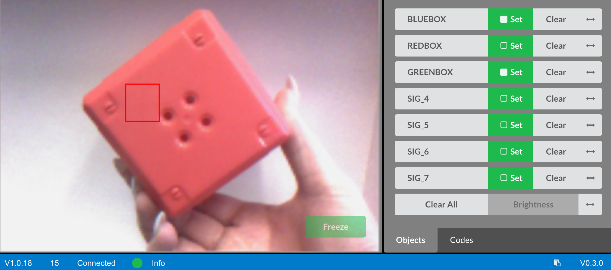 Vision utility showing a selected area on a red object used to define a new color signature.