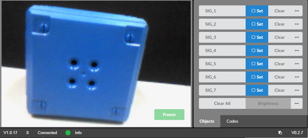 Vision Utility showing camera view of a blue object with Freeze button available and signature controls displayed.