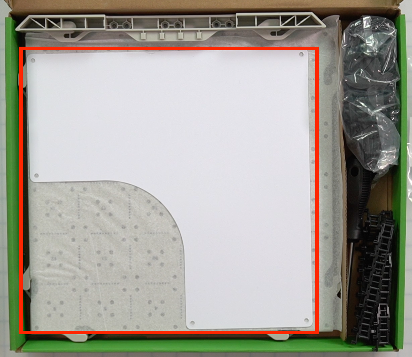 CTE Workcell Kit parts location in the center of the box atop the tiles.