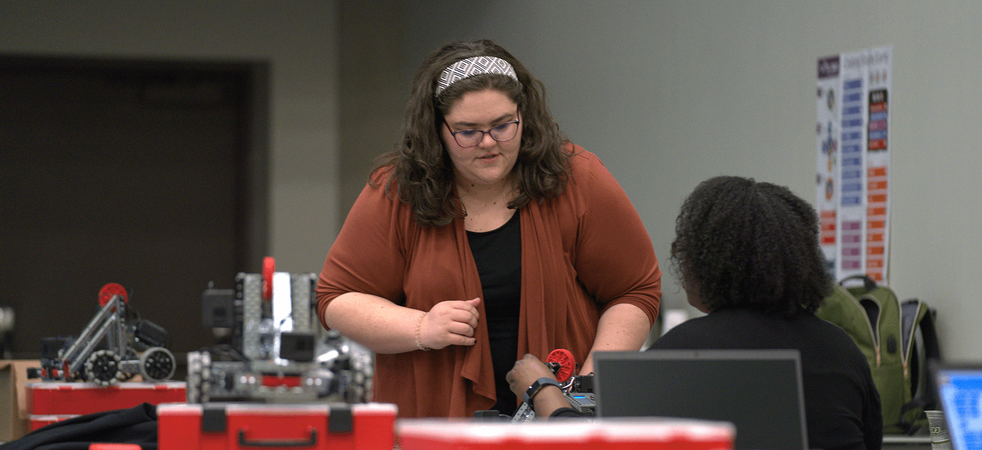 A member of the VEX education team meeting with a teacher