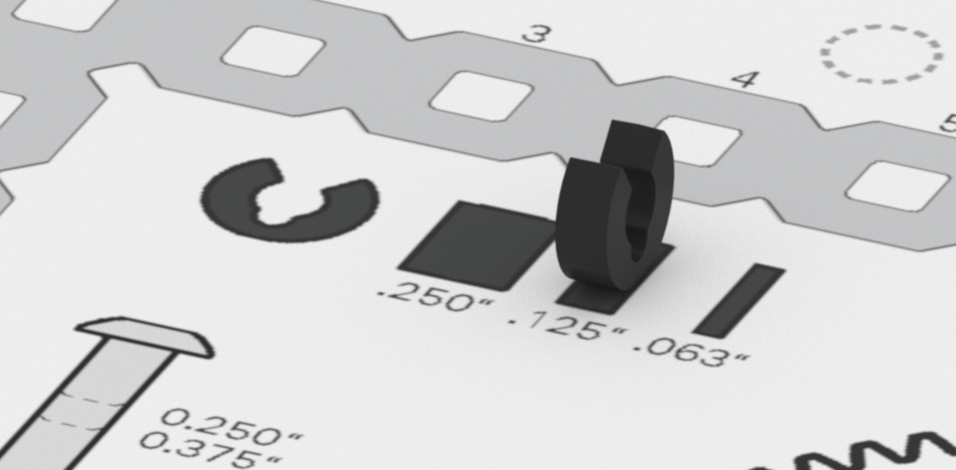 Close up of the spacers on the ruler, with a .125' spacer being compared to the same size spacer on the ruler.