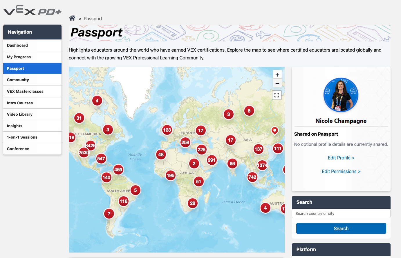 A screenshot of the VEX Passport page in PD+. On the left, the Passport option is selected in the Navigation. The Passport page features a large world map in the center with numbers in circles indicating VEX educators globally. On the right profile information is shown, with a search bar below it.