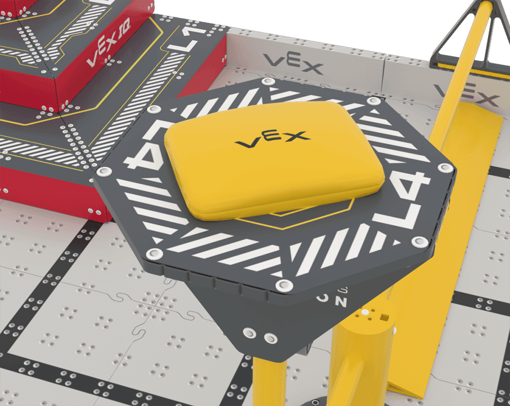 Elevated gray L4 Goal on the VEX IQ Level Up Field, with a yellow Bean Bag resting on top. The red Pyramid Goal and a yellow field structure are visible in the background.