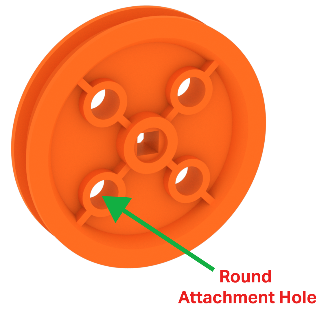 Διάγραμμα του κομματιού Orange Pulley, που δείχνει ότι έχει συνολικά 5 τρύπες. Όλες οι τρύπες είναι στρογγυλές εκτός από την κεντρική τρύπα, η οποία είναι τετράγωνη και προορίζεται να ταιριάζει στον άξονα της τροχαλίας.