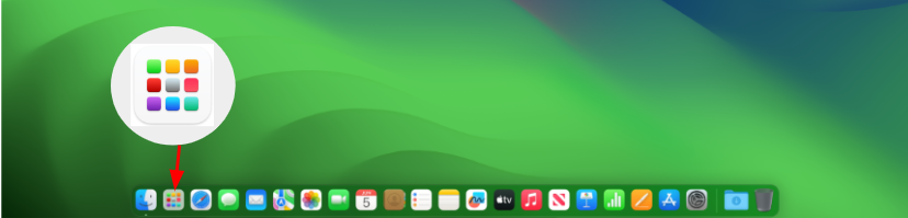 macOS Desktop με το εικονίδιο Launchpad να επισημαίνεται παρακάτω στο Dock.