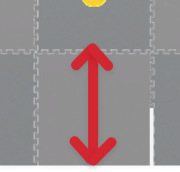 Primer plano de una sección de las losetas del campo, con una flecha que indica los bordes de la loseta y que se extiende entre los dos lados.